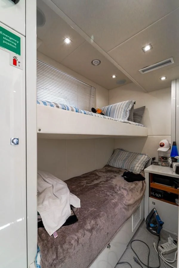 a bed in a room aboard 92' SUNSEEKER 2016 Yacht for Sale