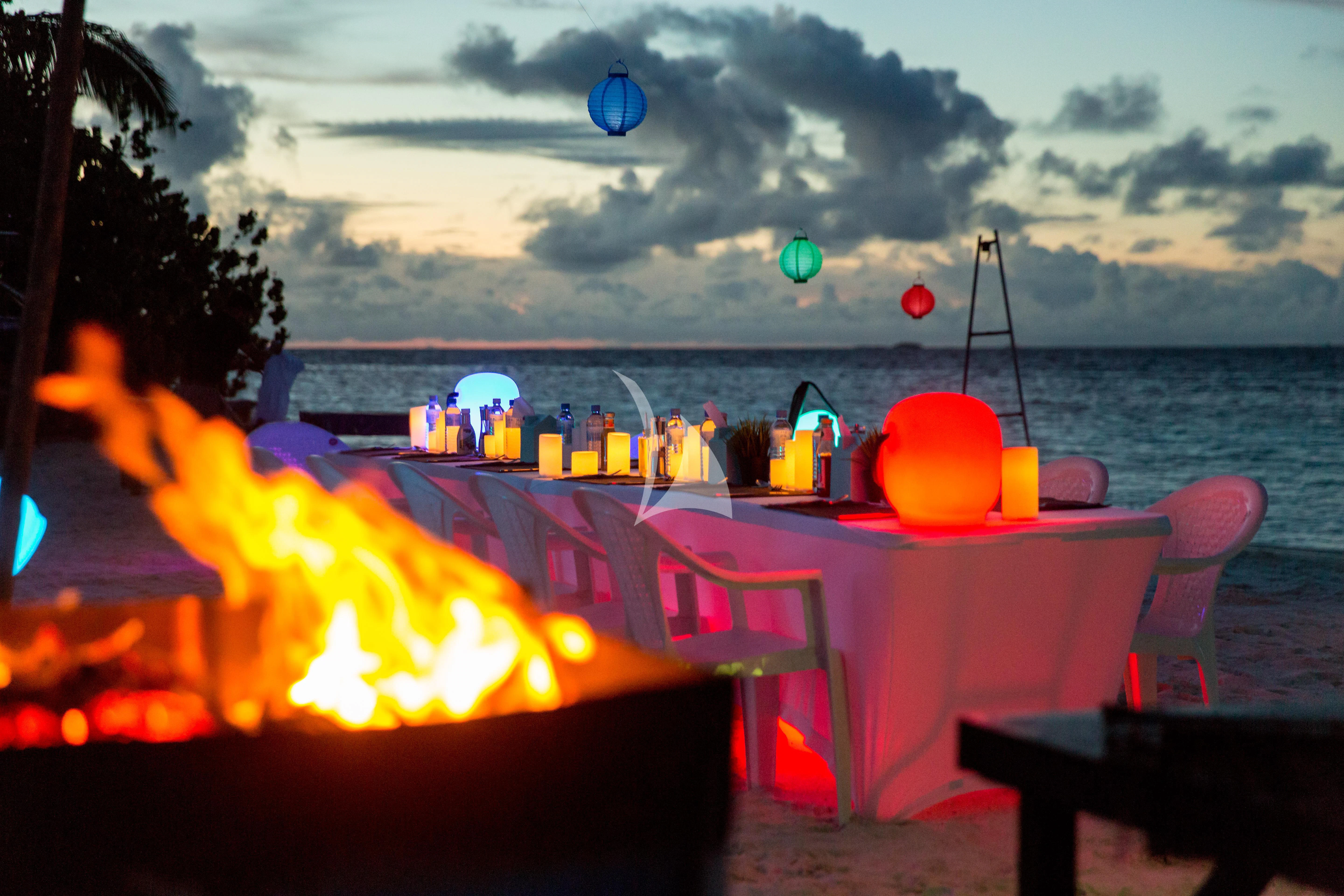 a table with a fire and a fire on it aboard AZALEA Yacht for Sale