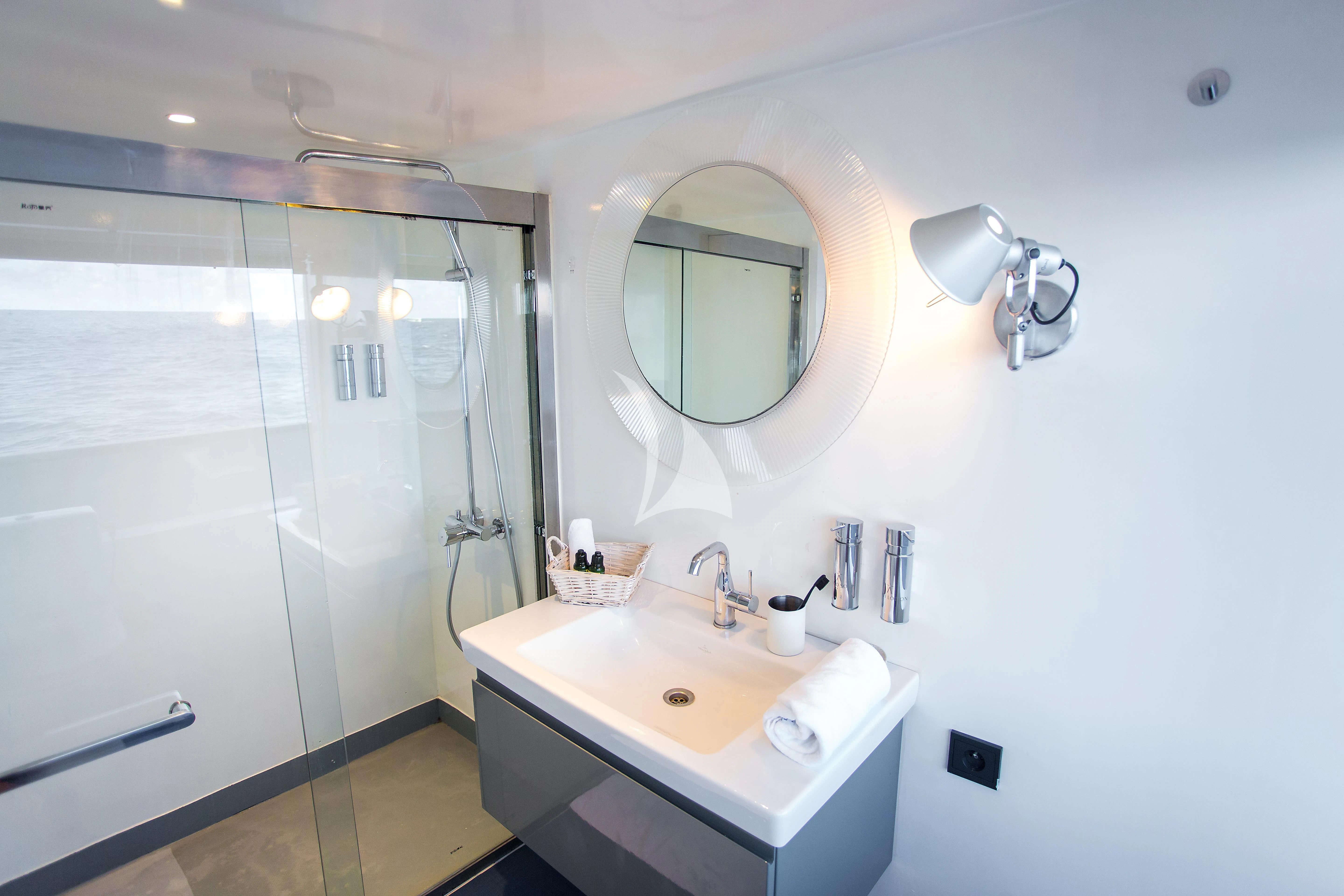 a bathroom with a large mirror aboard AZALEA Yacht for Sale