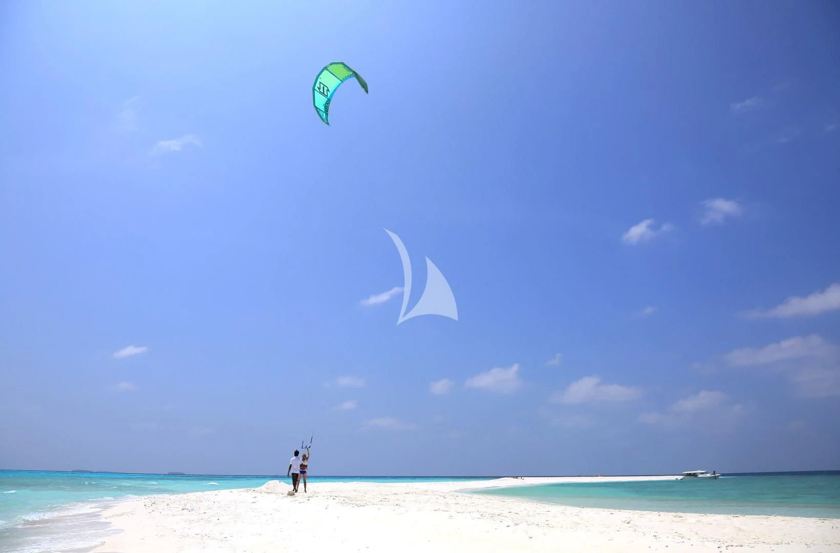 a person flying a kite on a beach aboard AZALEA Yacht for Sale