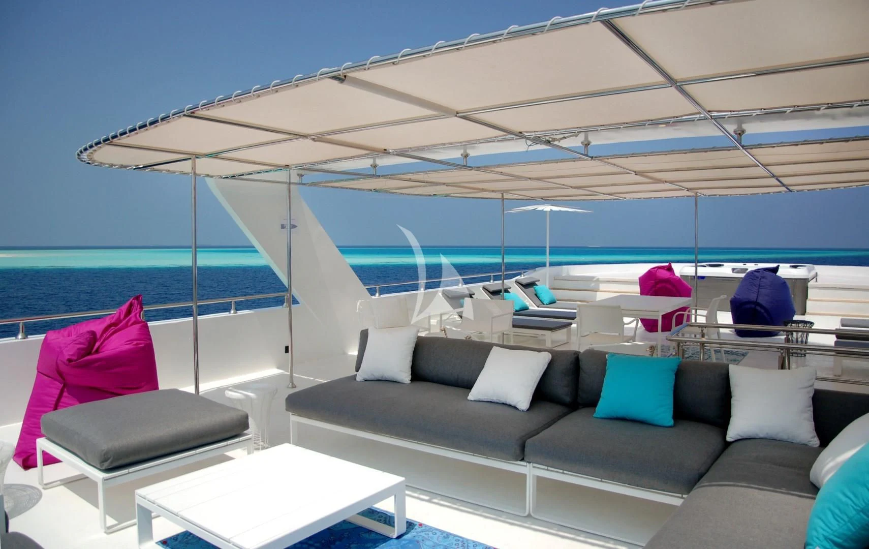 a boat with a couch and a table and chairs aboard AZALEA Yacht for Sale