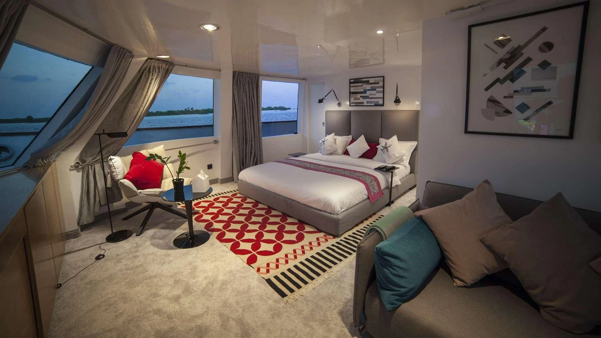 a bedroom with a bed and a tv aboard AZALEA Yacht for Sale