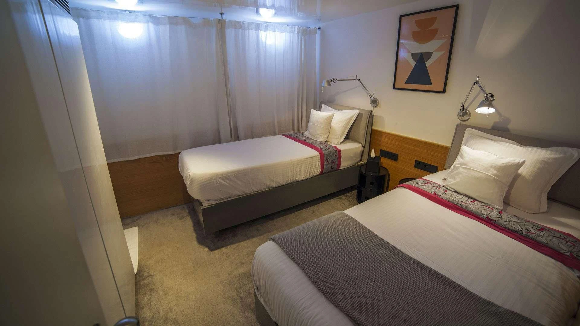 a room with two beds aboard AZALEA Yacht for Sale