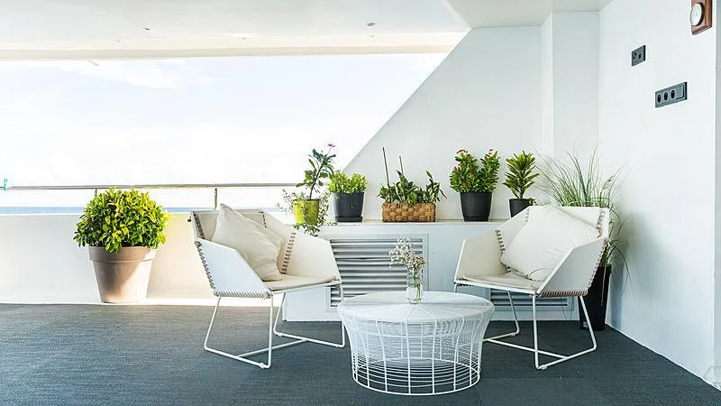 a room with a table and chairs aboard AZALEA Yacht for Sale