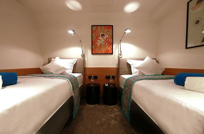 a couple of beds in a hotel room aboard AZALEA Yacht for Sale