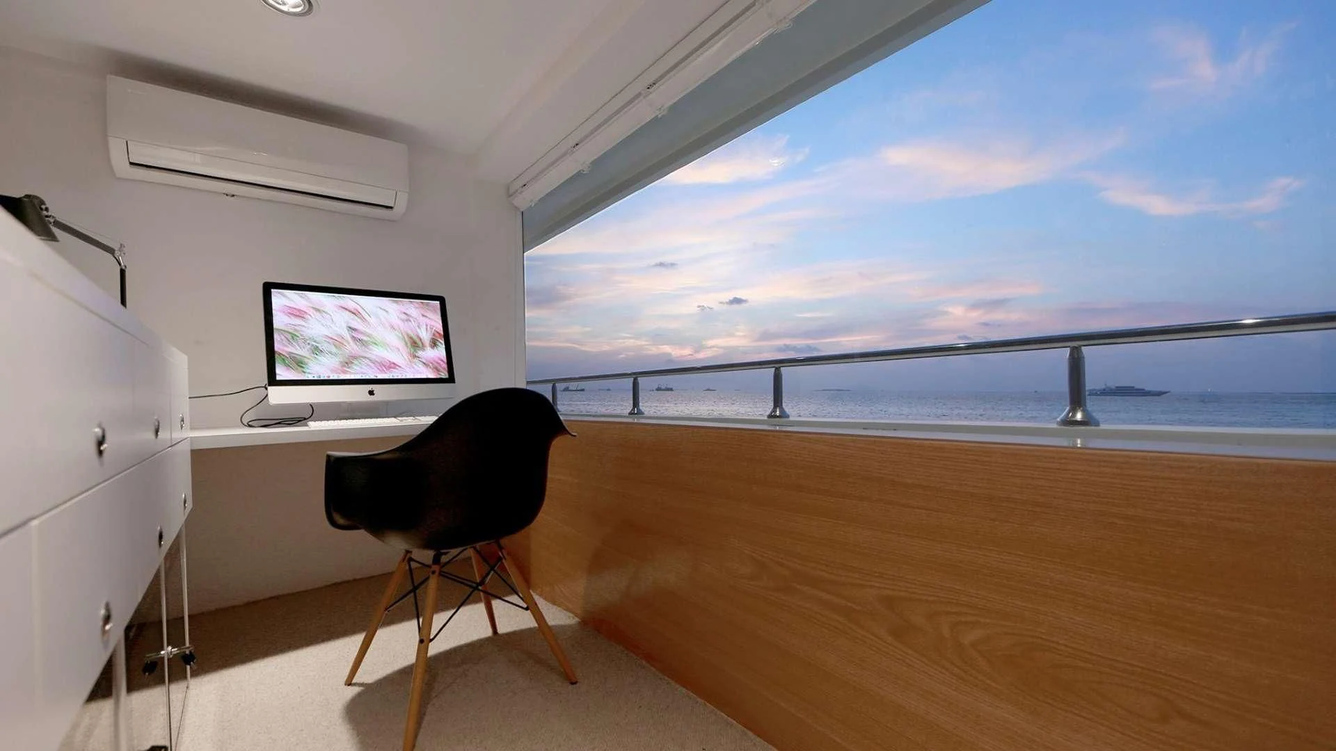 a room with a tv and a chair aboard AZALEA Yacht for Sale