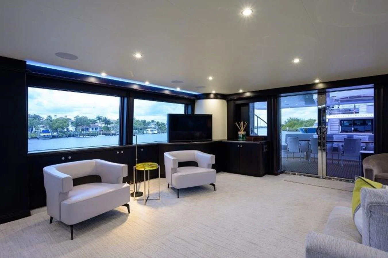 a living room with a large window aboard ODYSSEY Yacht for Sale