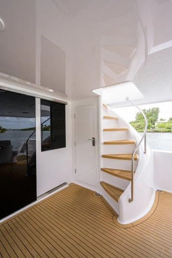 a wooden staircase in a house aboard ODYSSEY Yacht for Sale