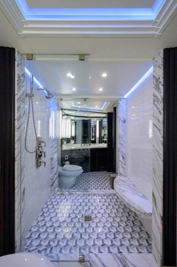 a bathroom with a large mirror aboard ODYSSEY Yacht for Sale