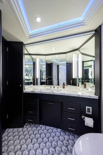 a bathroom with a large mirror aboard ODYSSEY Yacht for Sale