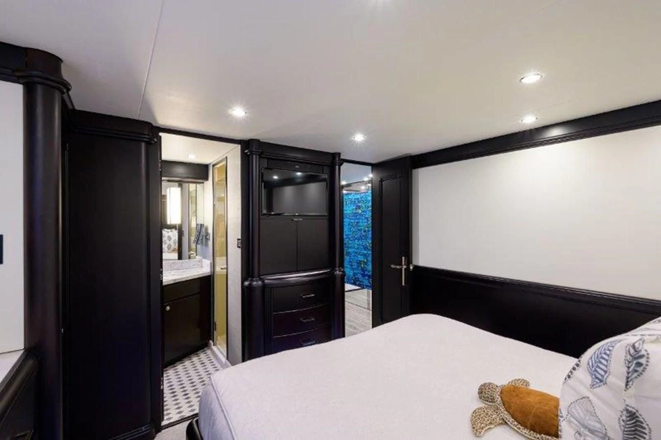 a bedroom with a large black cabinet aboard ODYSSEY Yacht for Sale