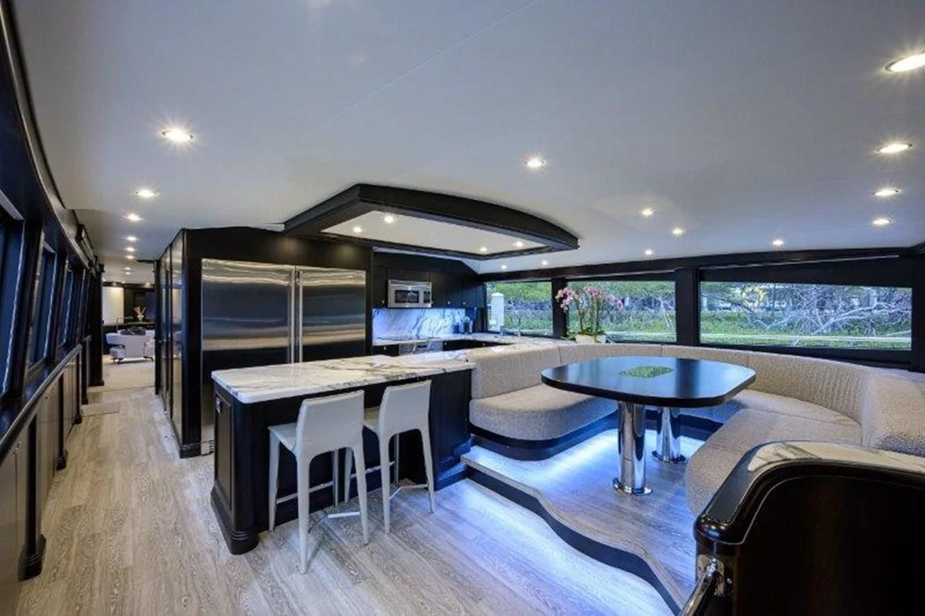 a large living room with a pool aboard ODYSSEY Yacht for Sale
