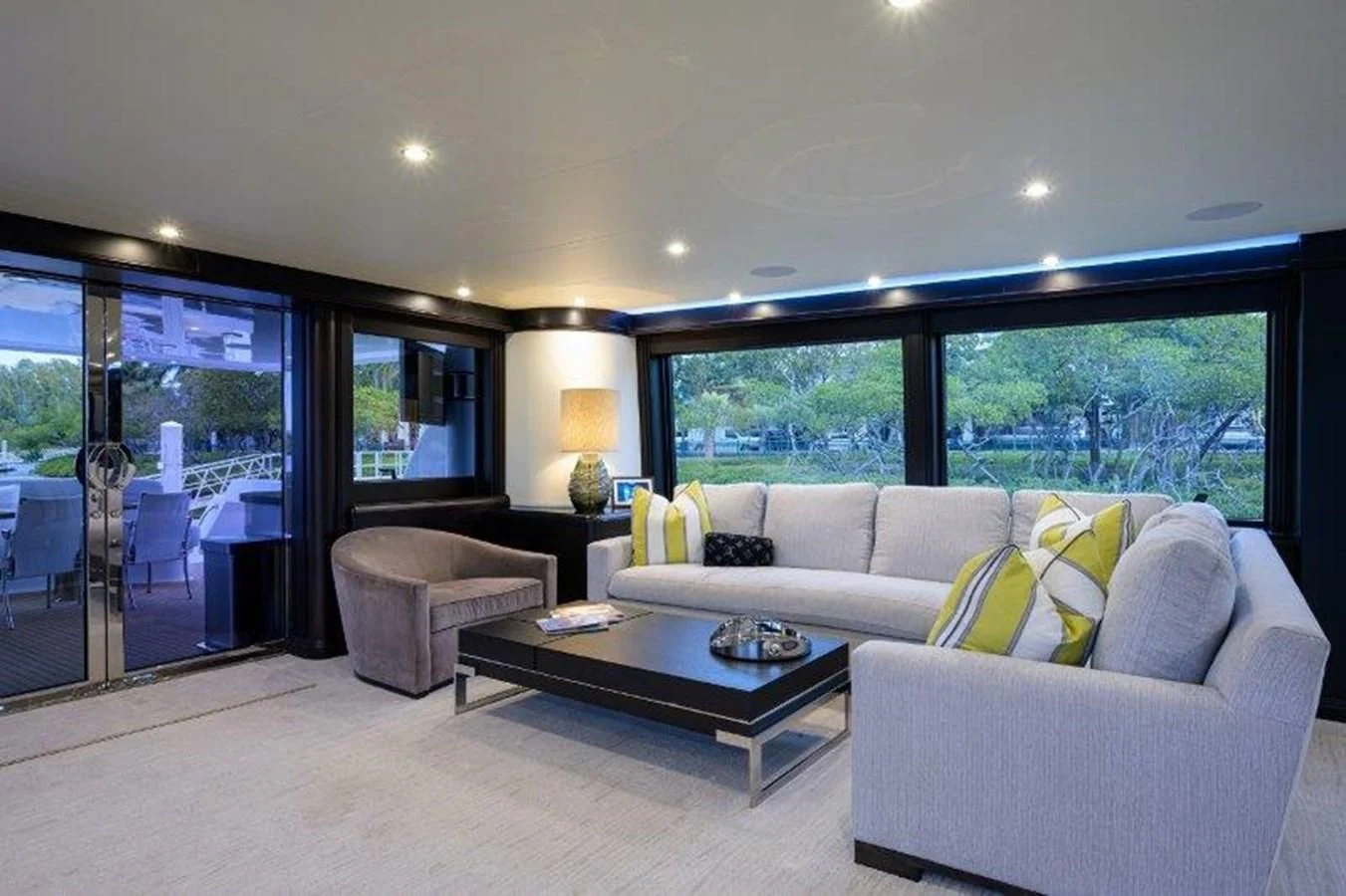 a living room with a large window aboard ODYSSEY Yacht for Sale