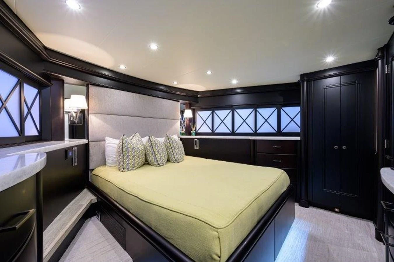 a bedroom with a bed and a desk aboard ODYSSEY Yacht for Sale
