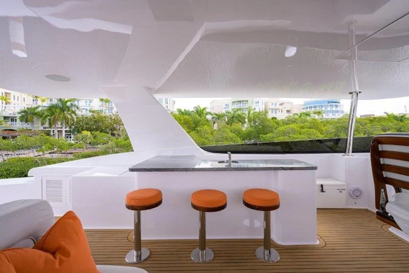 a group of stools in a room with a window aboard ODYSSEY Yacht for Sale