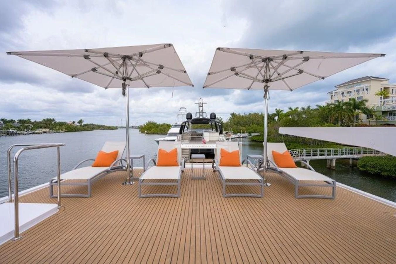a deck with lounge chairs and umbrellas on it aboard ODYSSEY Yacht for Sale