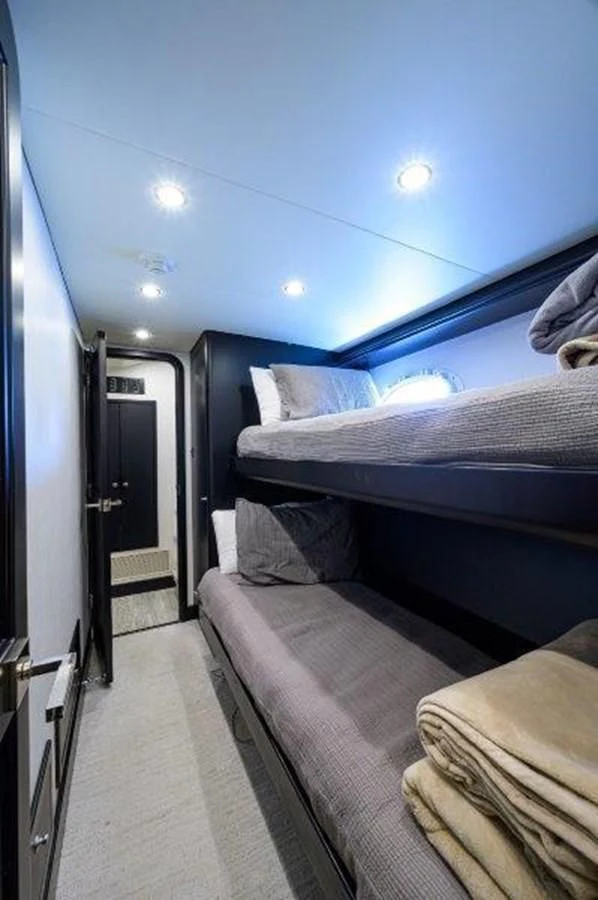 a room with bunk beds aboard ODYSSEY Yacht for Sale