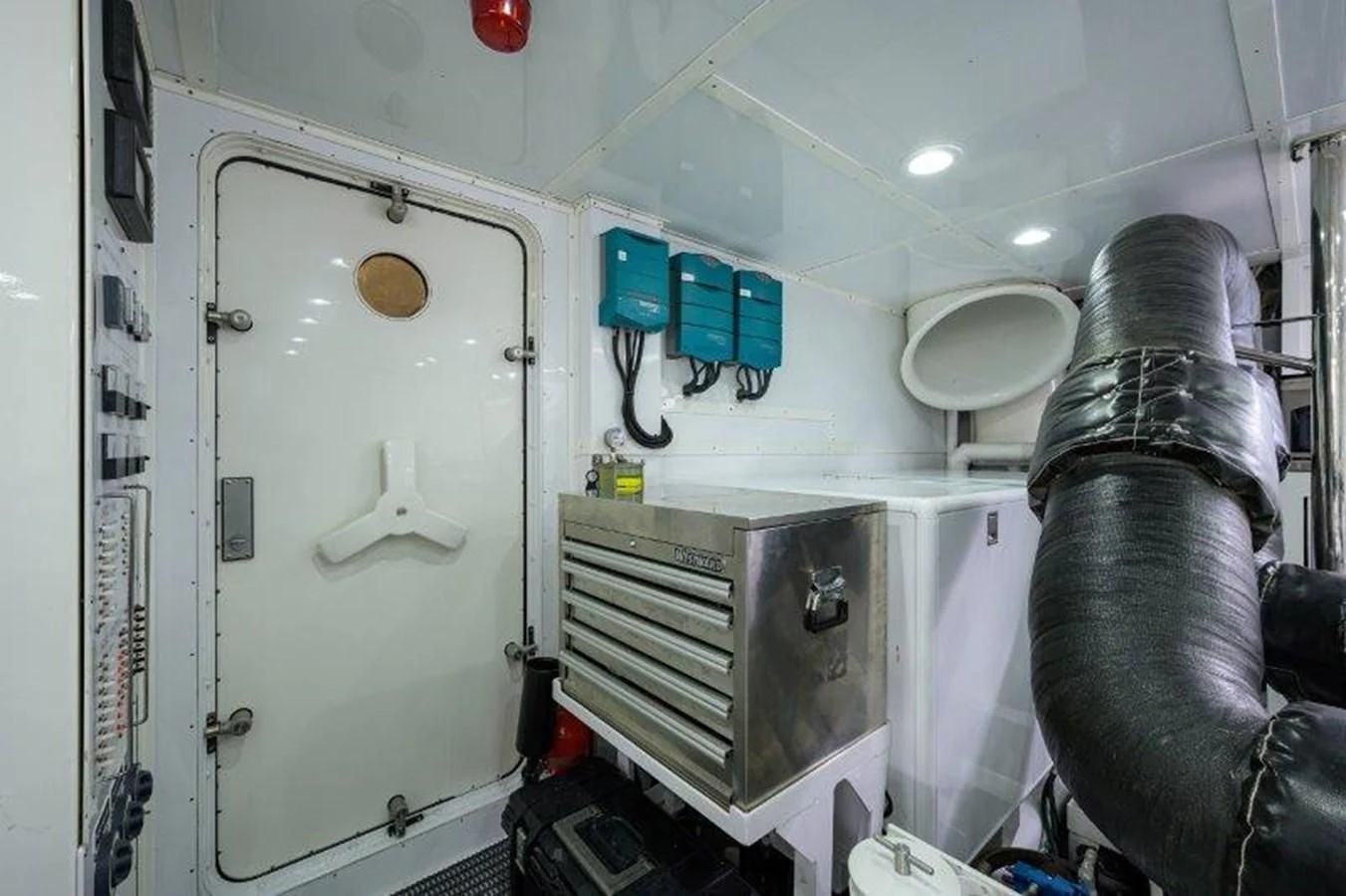 a person standing next to a machine aboard ODYSSEY Yacht for Sale