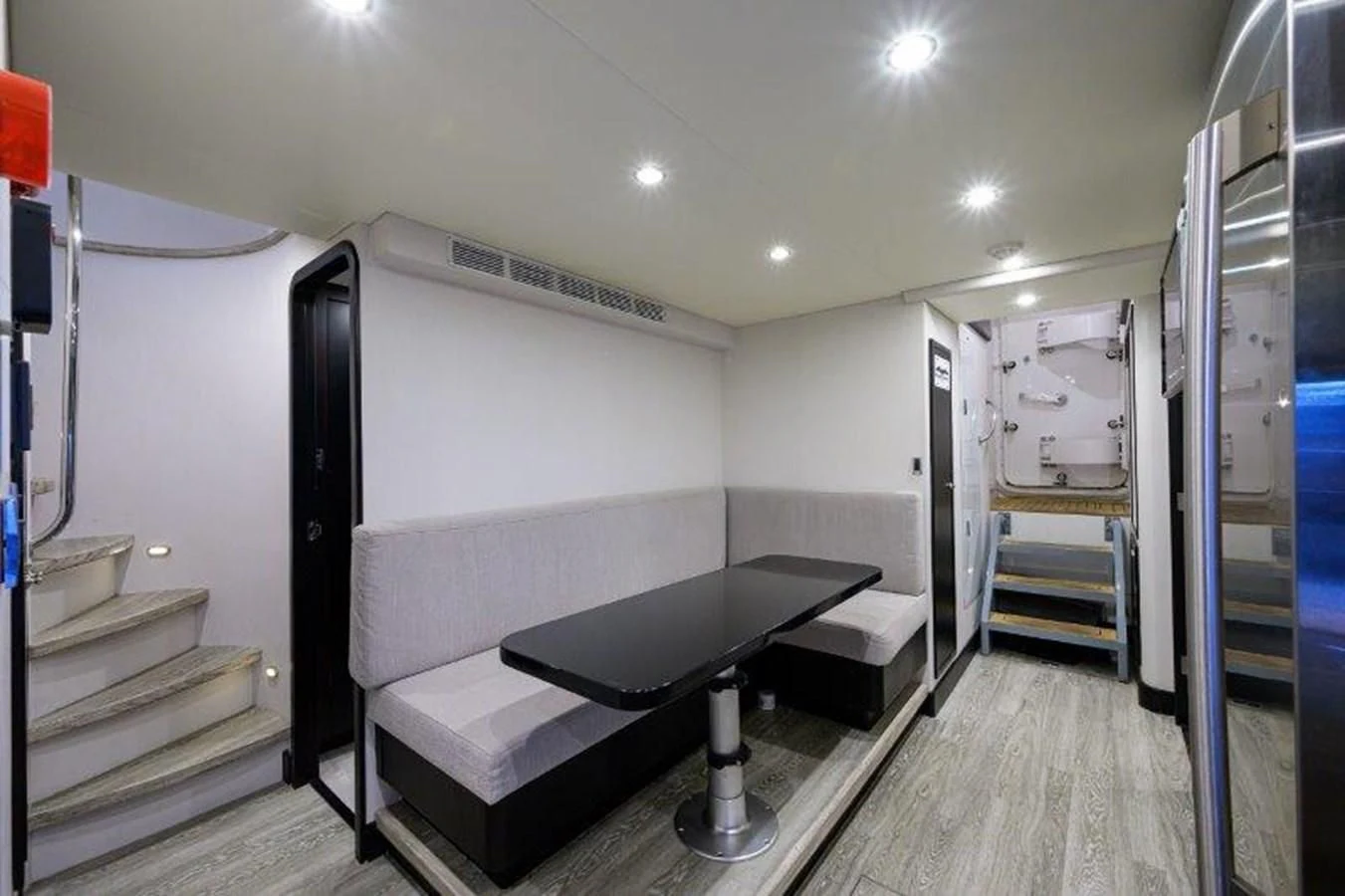 a room with a bed and a desk aboard ODYSSEY Yacht for Sale