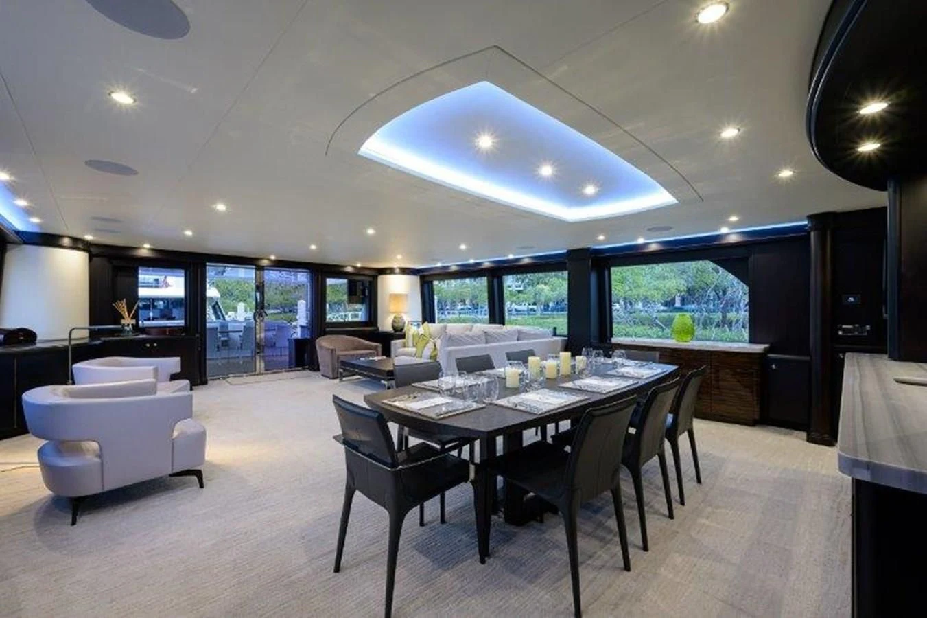 a large room with a table and chairs aboard ODYSSEY Yacht for Sale