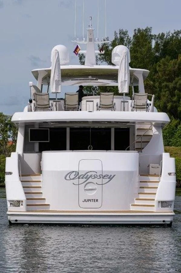 a white boat with a white structure on it aboard ODYSSEY Yacht for Sale