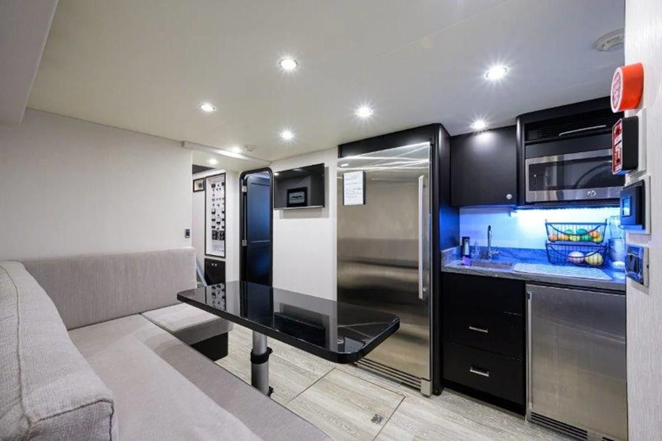 a large kitchen with a large glass display case aboard ODYSSEY Yacht for Sale
