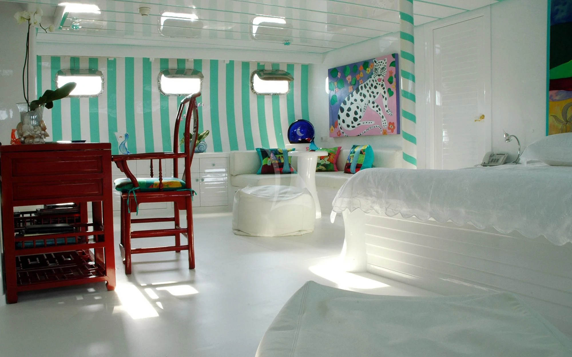 a room with a chair and a bed aboard MATA MUA Yacht for Sale
