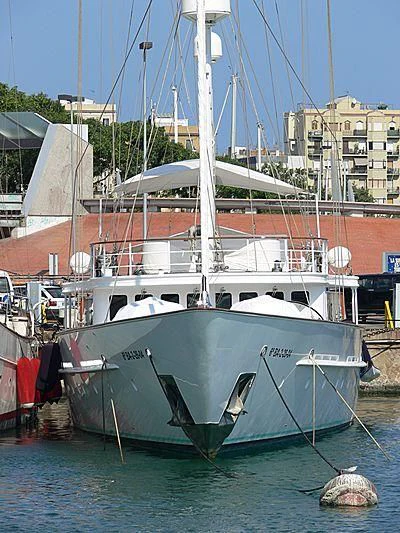 a boat docked in a harbor aboard MATA MUA Yacht for Sale