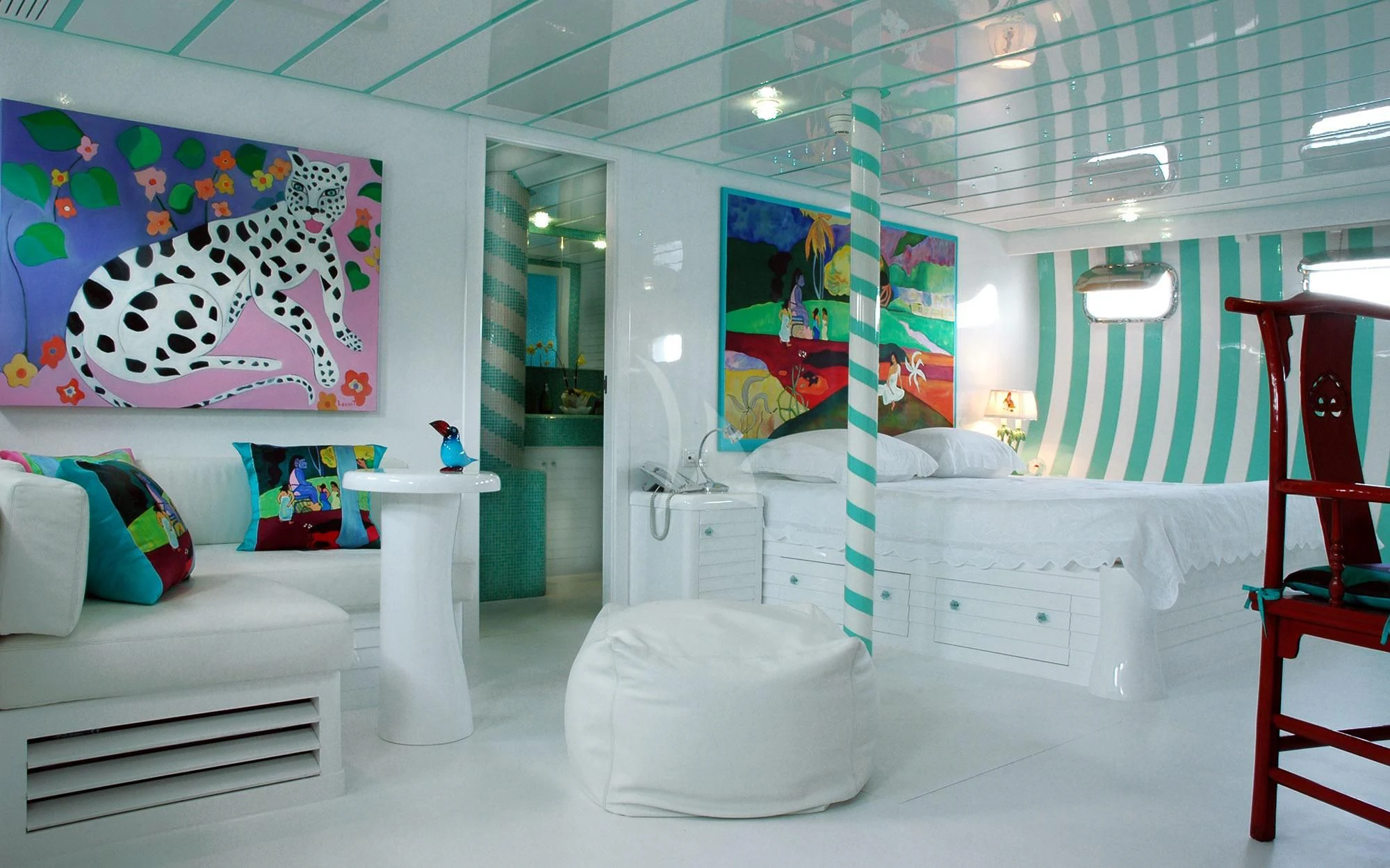 a room with a bed and a chair aboard MATA MUA Yacht for Sale