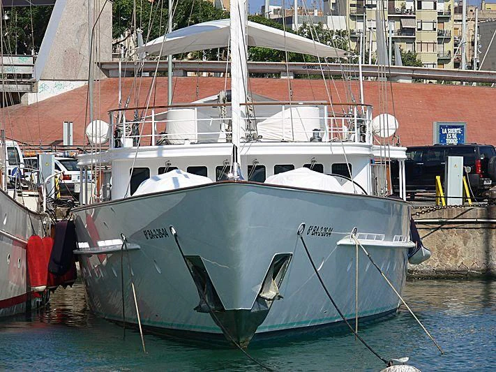 a boat docked at a pier aboard MATA MUA Yacht for Sale
