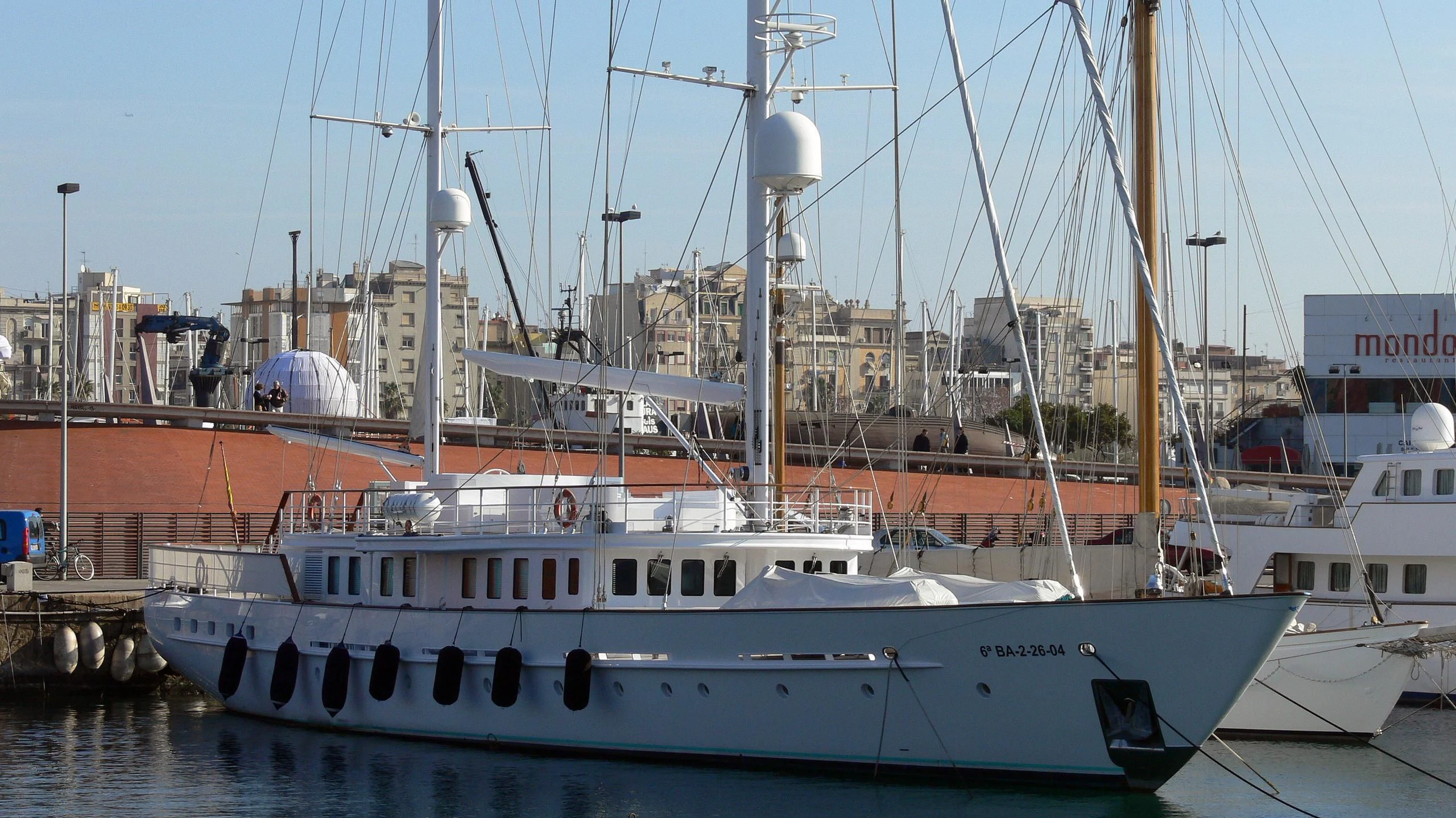a couple of boats are parked in a harbor aboard MATA MUA Yacht for Sale