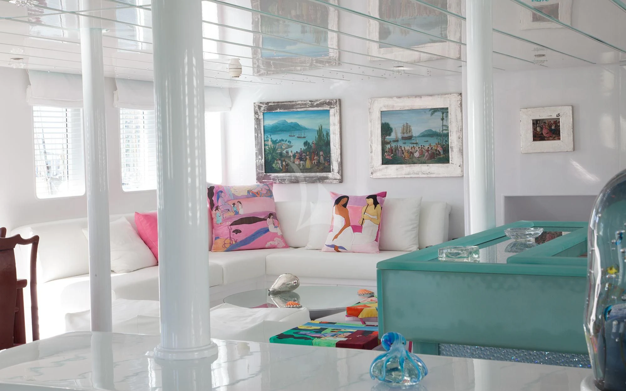 a room with a white couch and a table with toys on it aboard MATA MUA Yacht for Sale