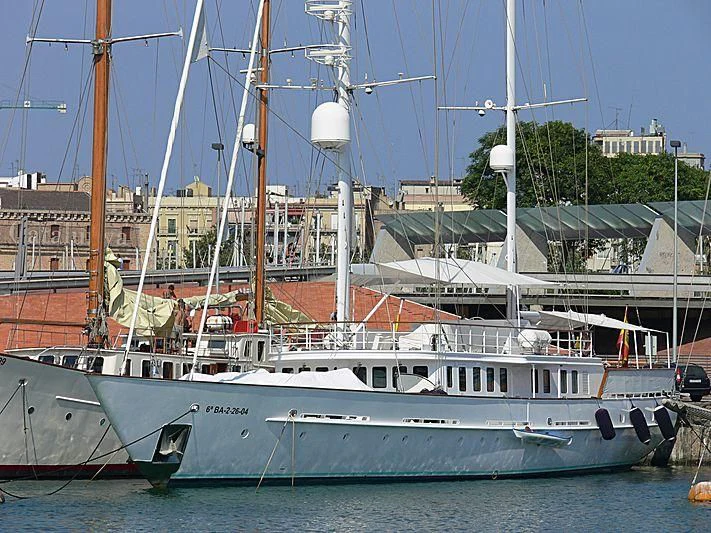 a boat docked at a pier aboard MATA MUA Yacht for Sale