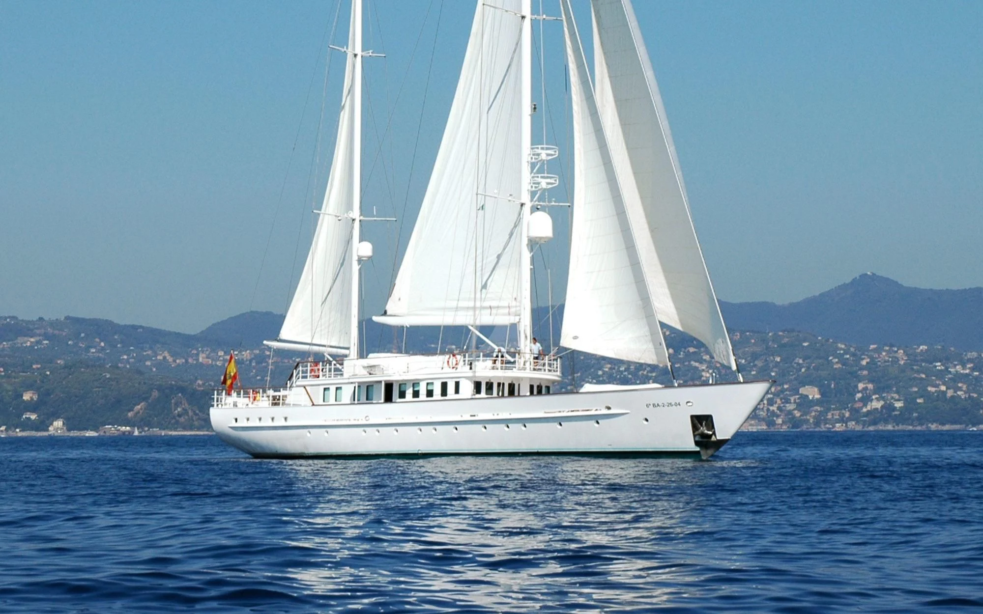 a white sailboat on the water aboard MATA MUA Yacht for Sale