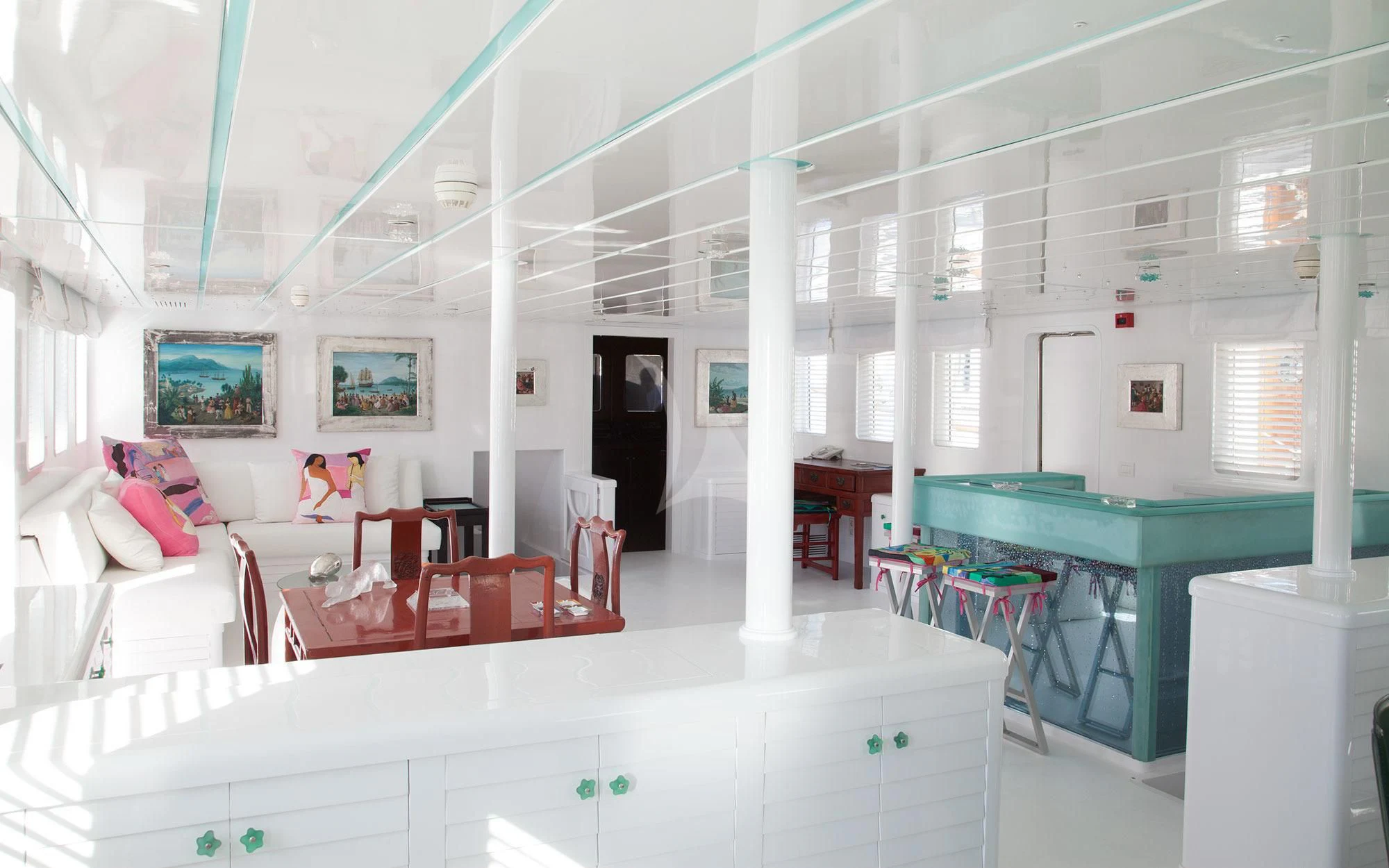 a room with tables and chairs aboard MATA MUA Yacht for Sale