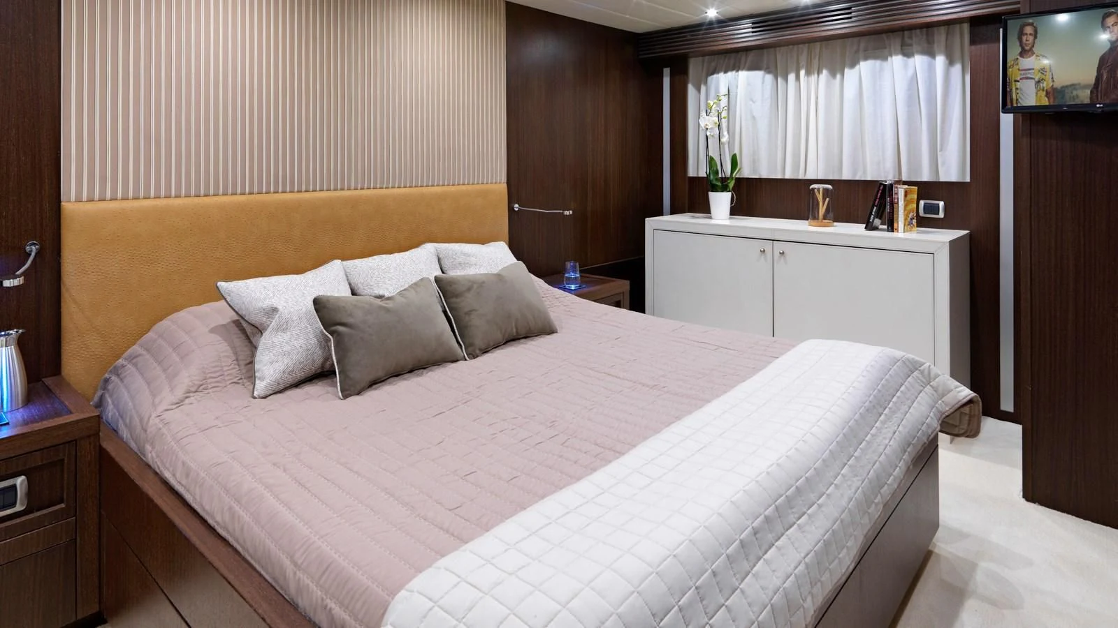 a bed with white sheets aboard RUBY Yacht for Charter