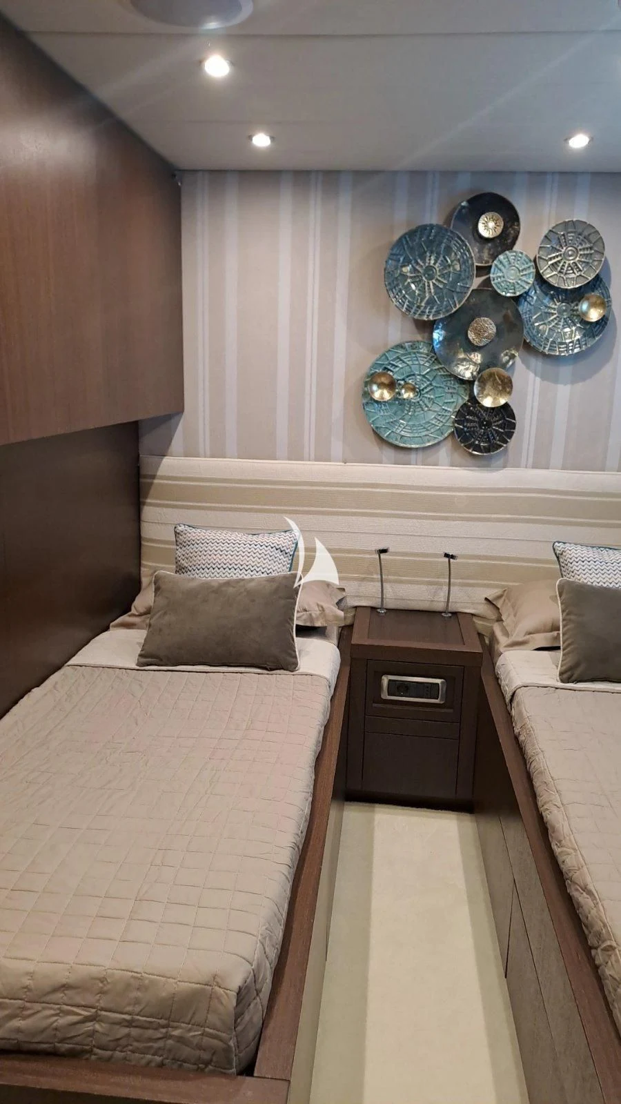 a room with a bed and a couple of large balloons aboard RUBY Yacht for Charter