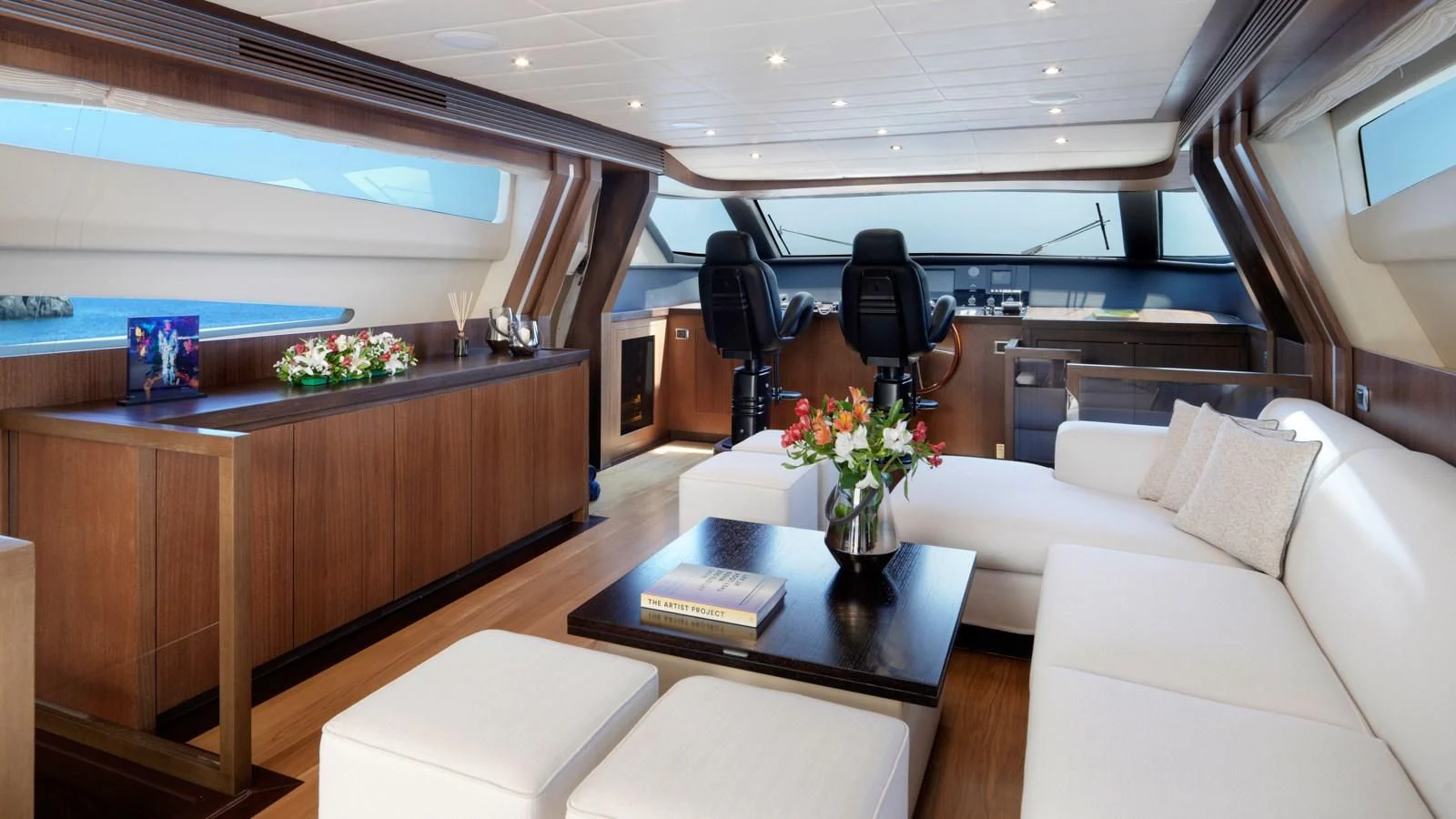 a room with a table and couches aboard RUBY Yacht for Charter
