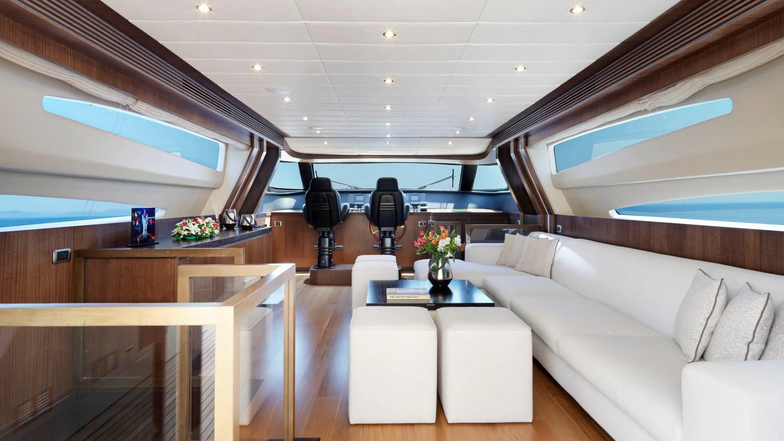 a room with a couch and a table and chairs aboard RUBY Yacht for Charter