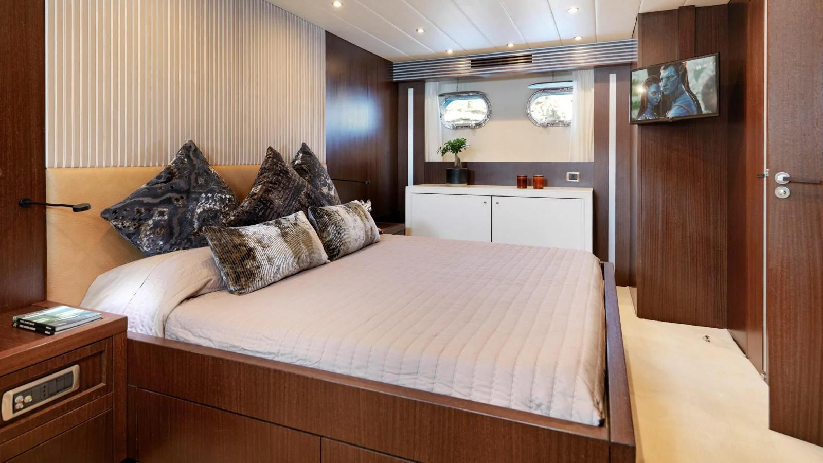 a bed with pillows aboard RUBY Yacht for Charter