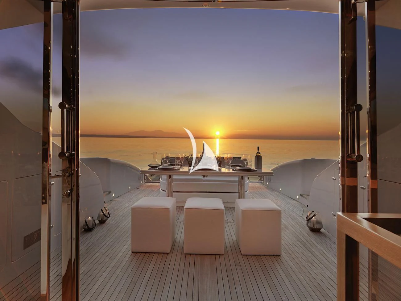 a room with a view of the ocean and the sunset aboard RUBY Yacht for Charter