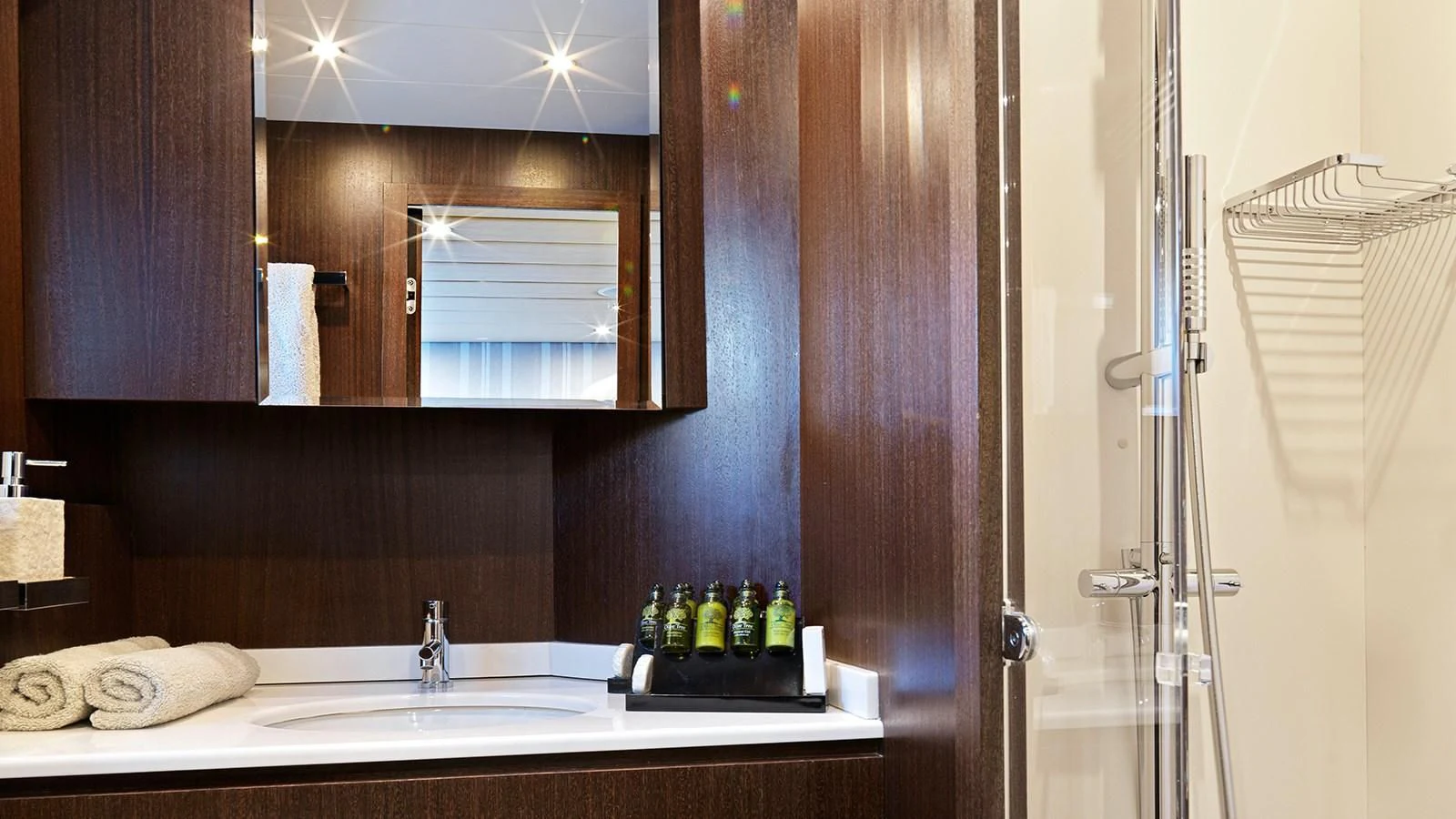 a bathroom with a sink and a mirror aboard RUBY Yacht for Charter