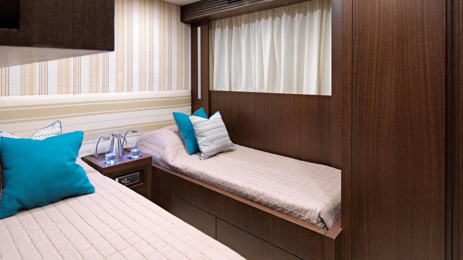 a room with a bed and a window aboard RUBY Yacht for Charter