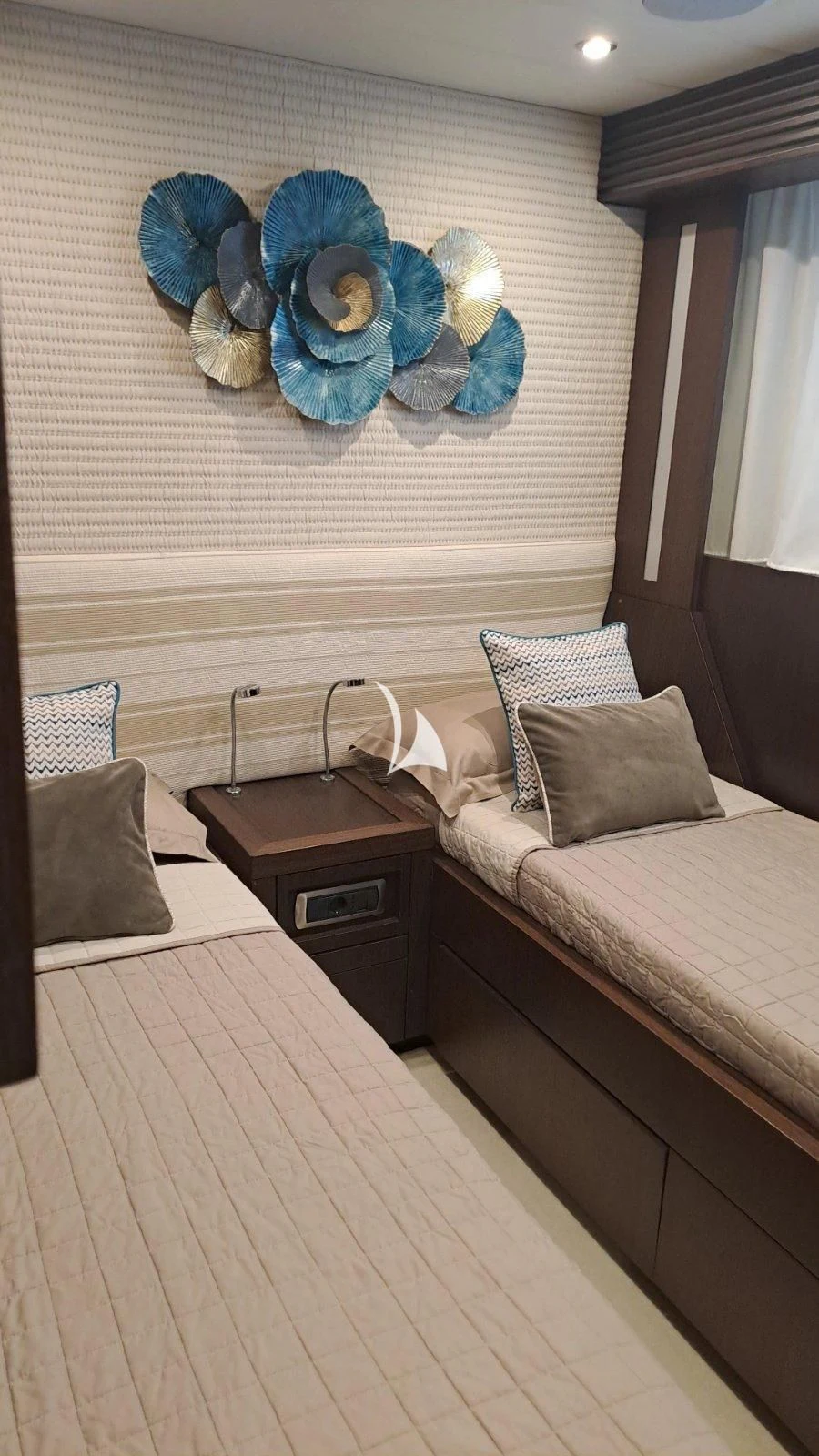 a bed with a stuffed animal on it aboard RUBY Yacht for Charter