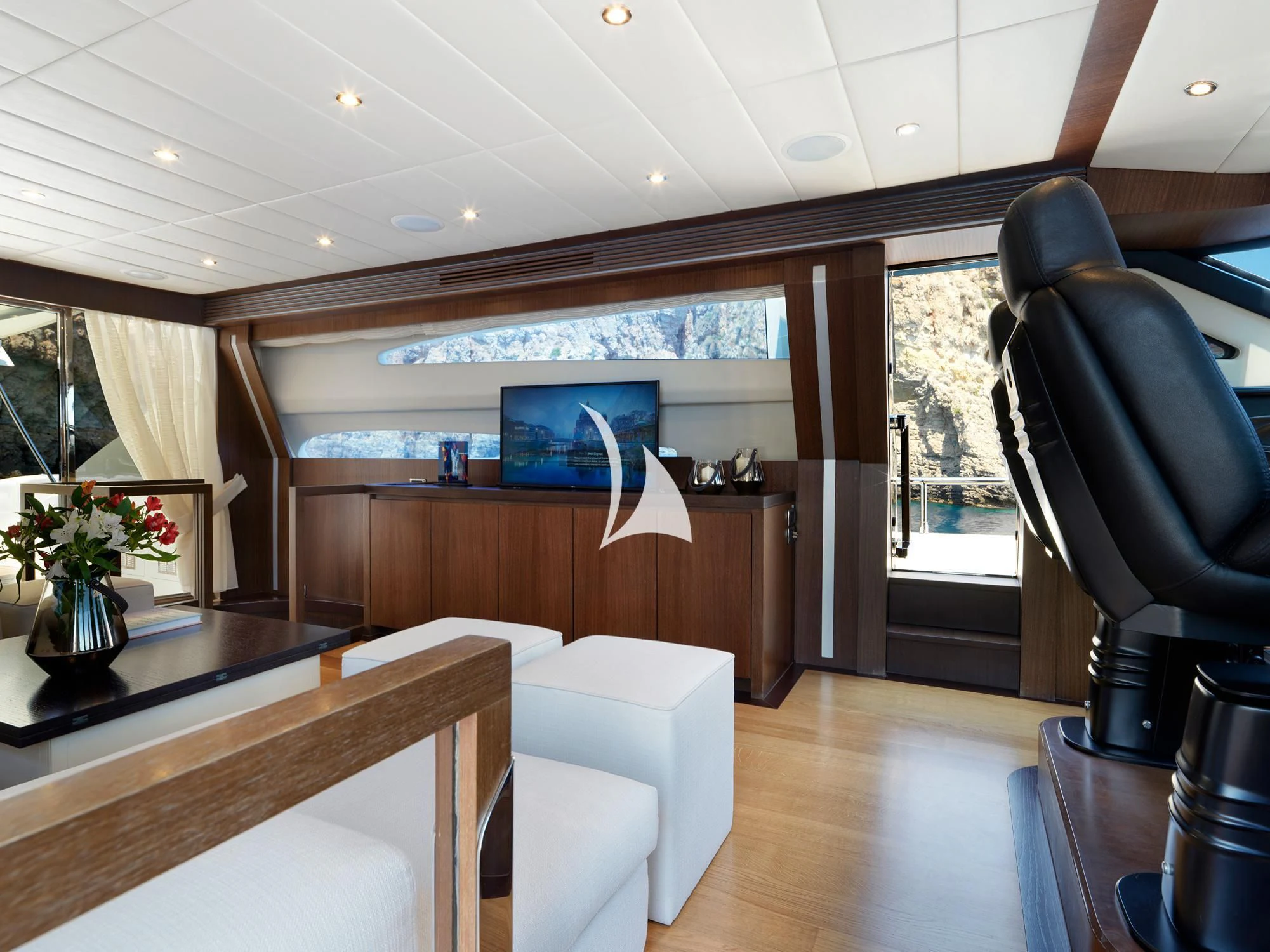 a room with a desk and chairs aboard RUBY Yacht for Charter