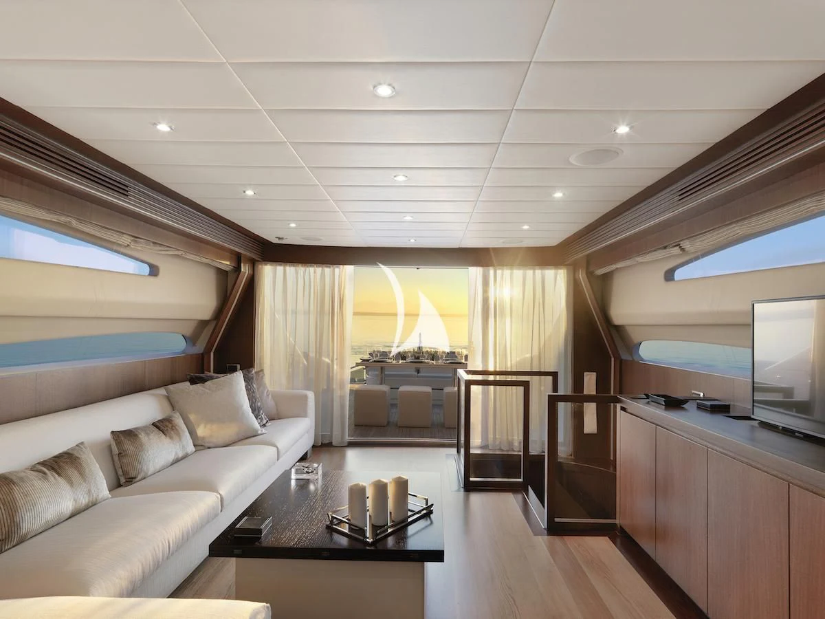 a living room with a couch and a table aboard RUBY Yacht for Charter