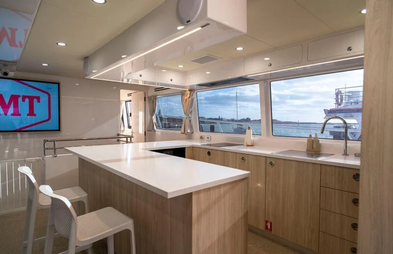 a kitchen with a large window aboard LA BELLA CHERIE Yacht for Sale