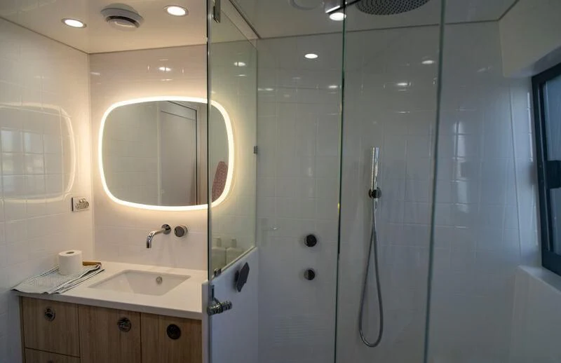 a bathroom with a shower unit and sink aboard LA BELLA CHERIE Yacht for Sale