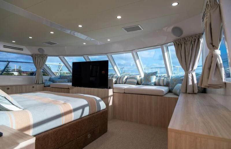 a room with a bed and a tv aboard LA BELLA CHERIE Yacht for Sale