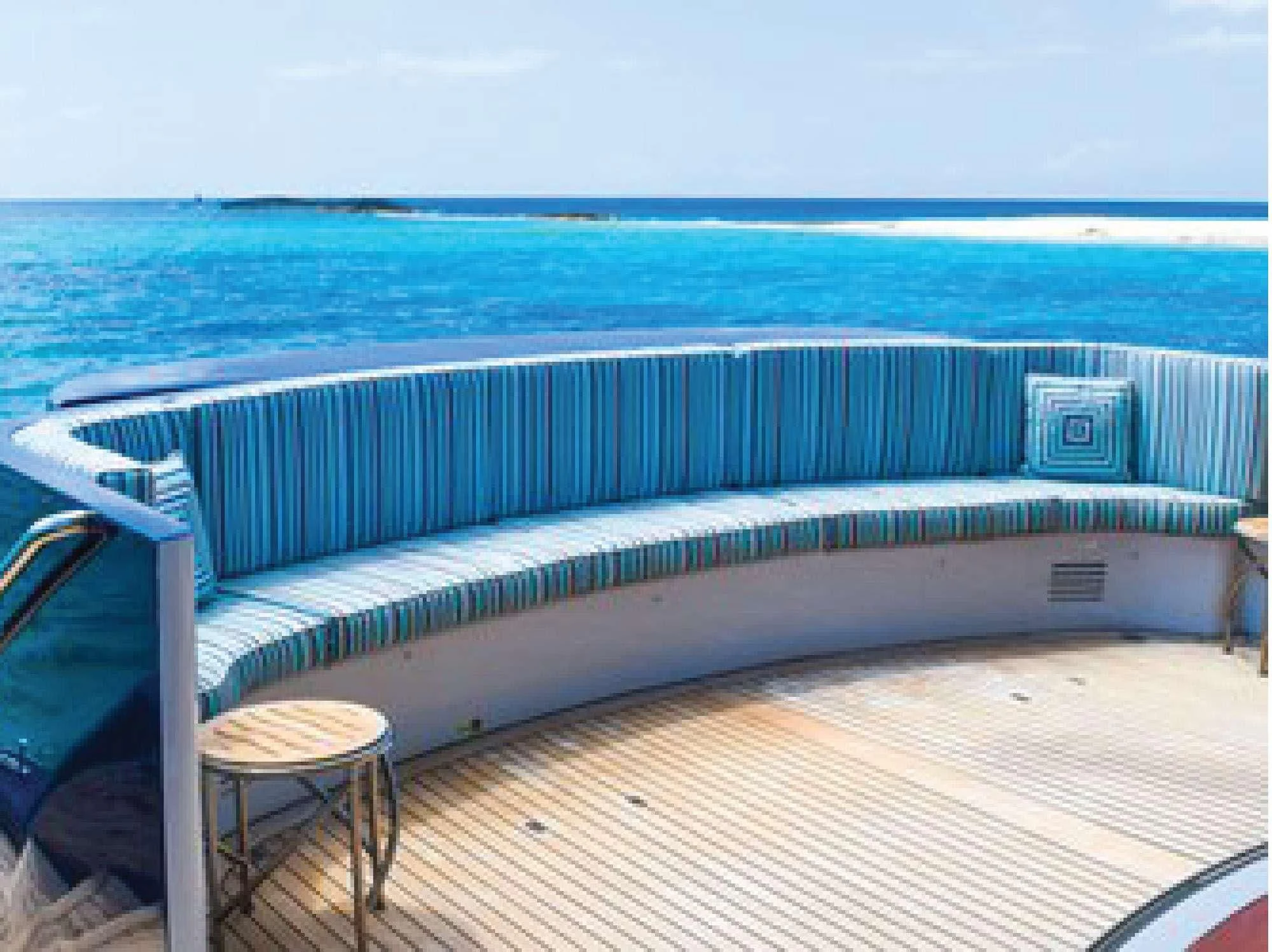 a deck with a view of the ocean aboard OCTOPUSSY Yacht for Sale